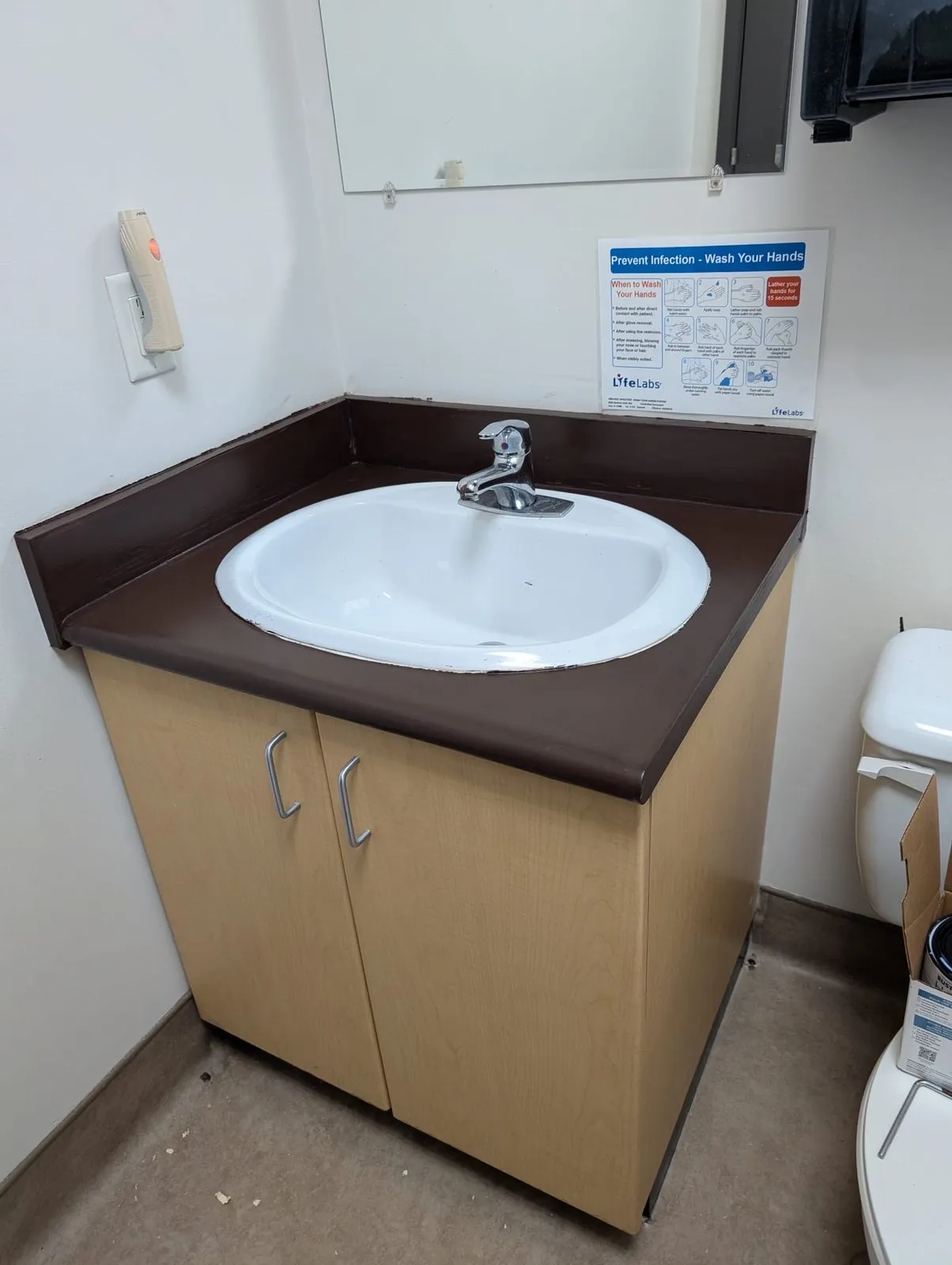 Clean bathroom vanity and new sink installed by our Metro Vancouver handyman team