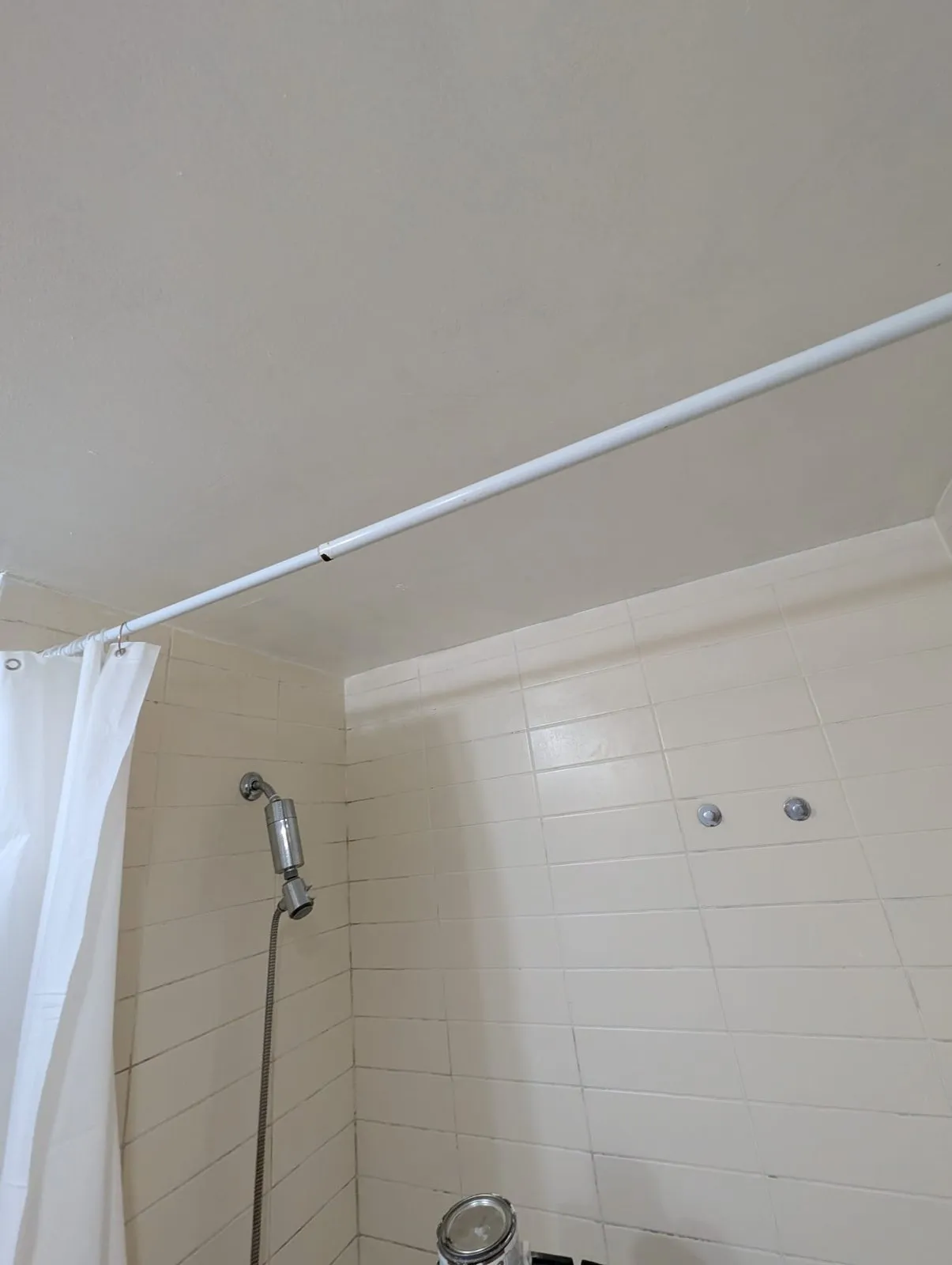 Same bathroom ceiling after our team patched, taped and repainted it above the shower