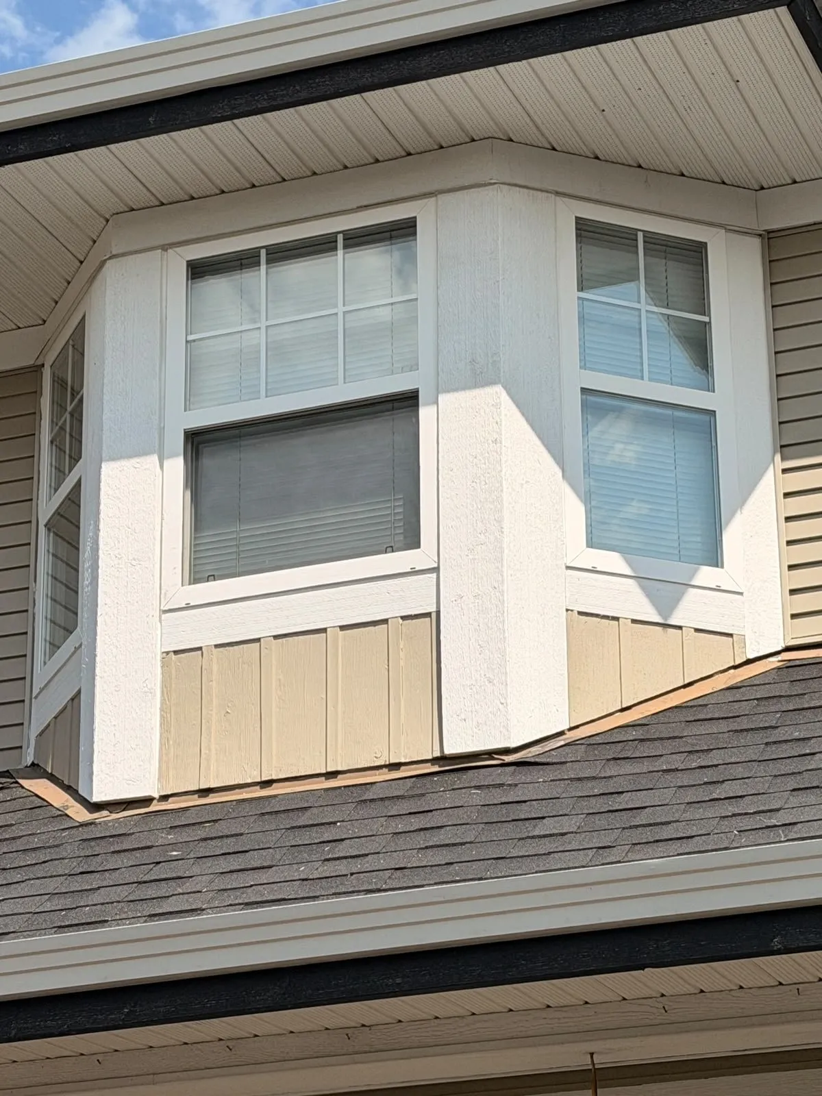 Bay window after our team replaced the siding boards and rebuilt the trim